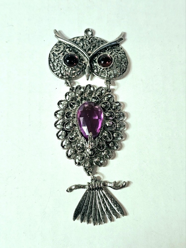 a Rare 1970s Articulated Owl Pendant featuring purple faux-amethyst glass…