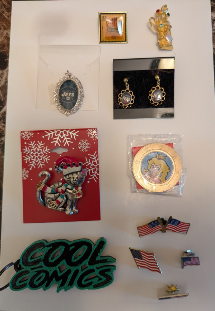11 pins- golf bag, NY Jet, postage stamp, Christmas Cat,Princess coin,4 US flags