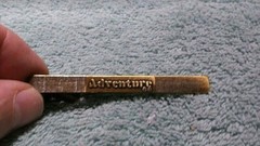 Vintage Brass Tone ADVENTURE AC GM Tie Clip
