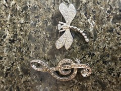 2 vintage unbranded Clear Rhinestone brooches in silvertone: G Clef & Dragonfly