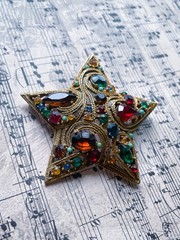 Vintage La Roca Gold Alloy Multicolor Rhinestone Star Brooch