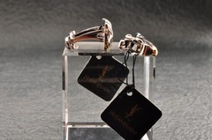 Near mint, gold and Cufflinks and silver tie clip, “Yves Saint Laurent”, case.