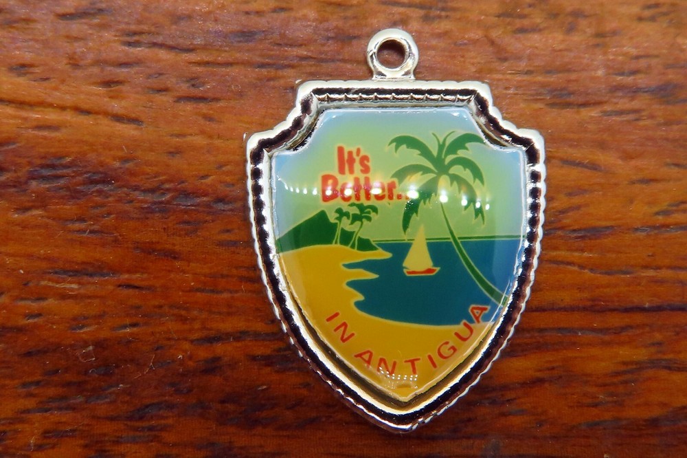 Vintage silver IT’S BETTER IN ANTIGUA CARIBBEAN ISLAND TRAVEL SHIELD charm 24-14