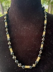 vintage-style black and gold beaded statement necklace,