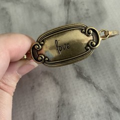Victorian revival cursive antique gold Love panel tension bangle bracelet