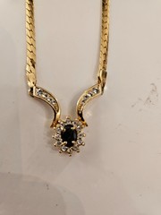 Gold tone necklace with black stone and cz’s.