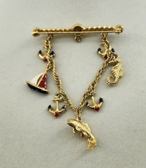 Unbranded Gold Tone Brooch Bar With Chain and 7 Nautical Themed Charms