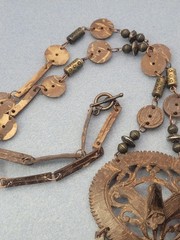 A set of tribal-style wooden and metal jewelry pendant necklace 26in Earrings.