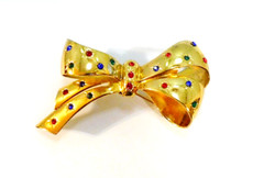 Vintage Signed CORO Bow Brooch Flush Set Jewel Tone Rhinestones Gold Plated Pin