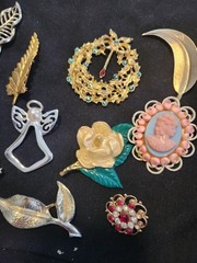 12 vintage Brooches. 1.5 inches – 3 inches big.