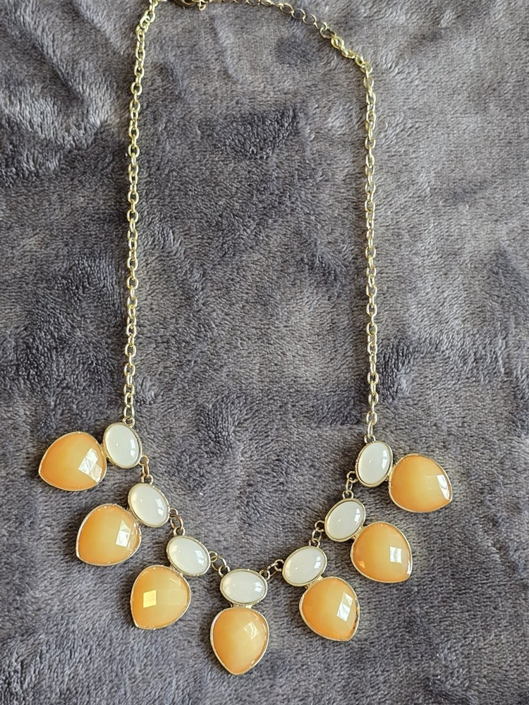 Vintage Bib necklace featuring orange and off-white acrylic stones. 21″
