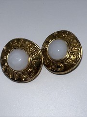 Vintage CHANEL golden round shape faux pearl earrings with cutout logo. Clip On