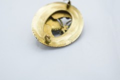 Antique Egyptian Revival winged scarab brooch featuring vibrant enamel work