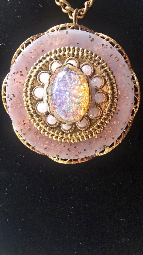 Vintage gold toned filigree pendant necklace with pink faux fire cabochon opal
