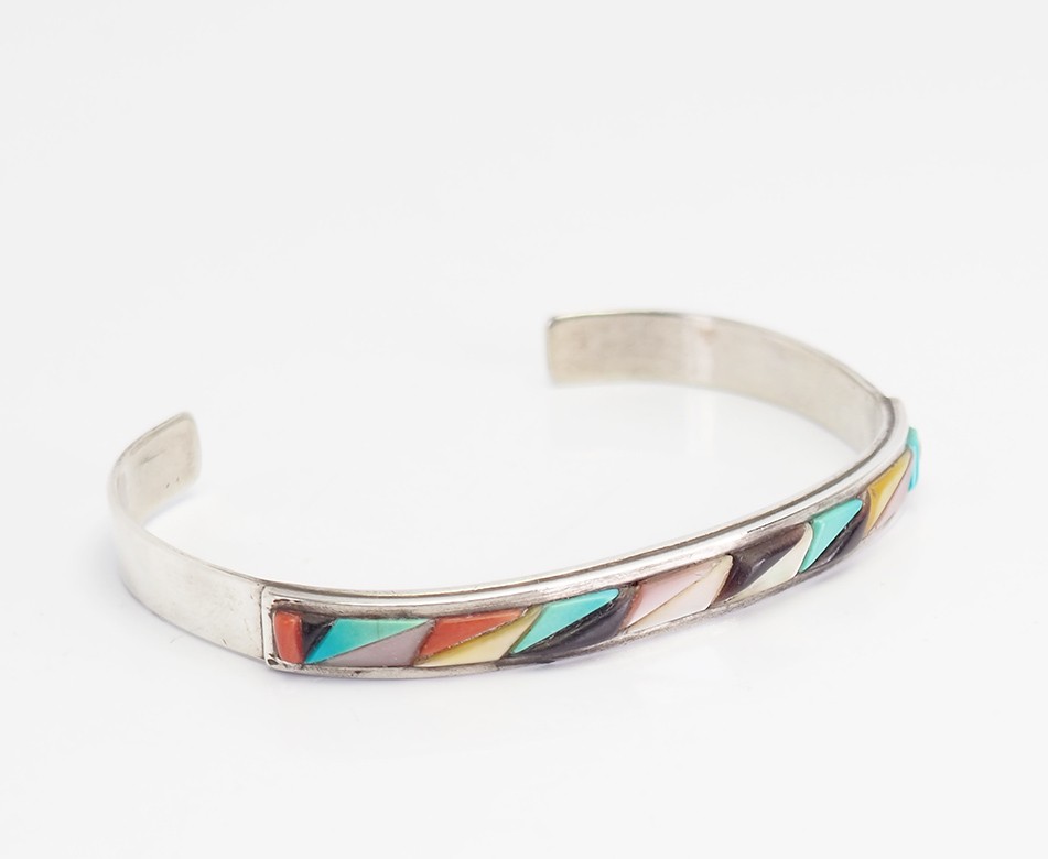 Vintage sterling silver and inlaid gemstones cuff bracelet by Victor Moses Begay