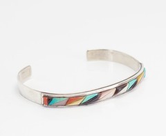 Vintage sterling silver and inlaid gemstones cuff bracelet by Victor Moses Begay