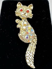 Bejeweled Feline Brooch Gold Tone With Man Made Aurora Borealis And Red Stones