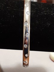 Crystal polka dot bangle bracelet Silvertone flush set stones eternity band