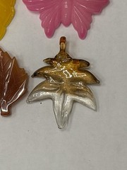 Lot Of 4 Vintage-style translucent plastic leaf and butterfly pendants/jewelry