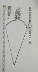 Delicate silver plated metalwork w pink and white stones in floral arrangement