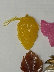 Lot Of 4 Vintage-style translucent plastic leaf and butterfly pendants/jewelry
