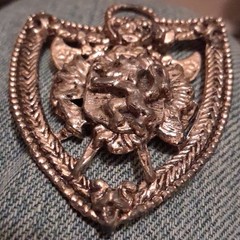 Silver Tone Shield Pin with Raised Animal Head Design, No Stone