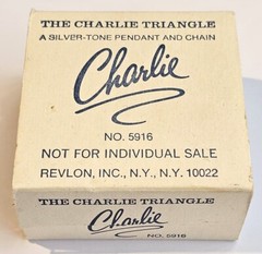 The Charlie Triangle Silver Tone Pendant Charm by Revlon Original Box Never Used
