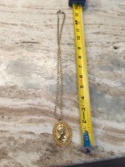 vintage Revlon women’s gold tone chain with metal cameo charm
