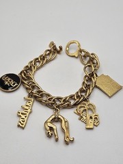 Vintage Jackie Collins Gold Tone Enamel Lady Boss Charm Bracelet Toggle Clasp