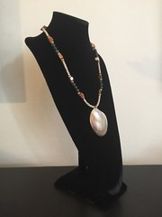 Shell Pendant on a Green, Gold, and Tan Necklace – 25.25 in.