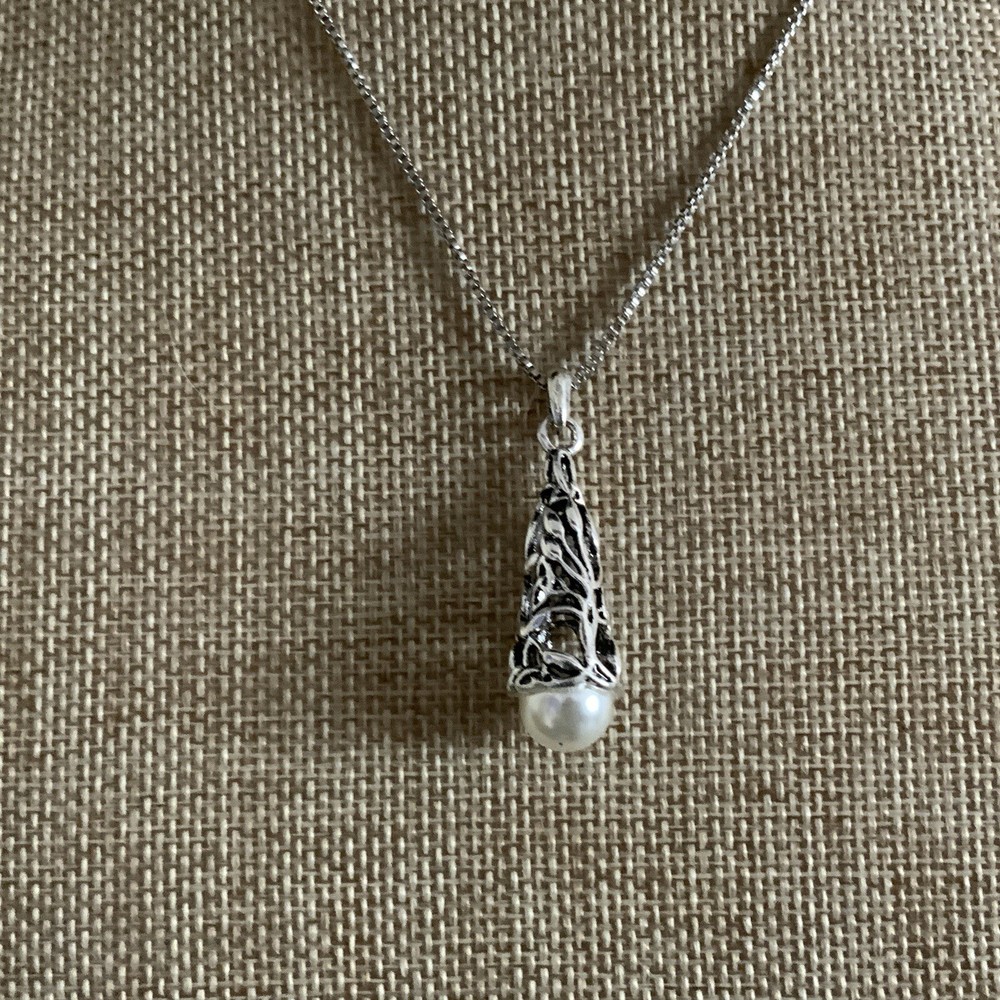 Faux pearl filigree cone necklace in silver tone metal on box chain