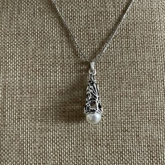 Faux pearl filigree cone necklace in silver tone metal on box chain