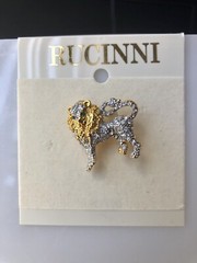 Rucinni Gold and White Lion brooch with White crystals and two green eyes.