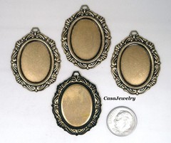 #1154 ANTIQUED GOLD 25X18 FILIGREE BORDER BEZEL W/TOP HANG RING – 4 Pc Lot