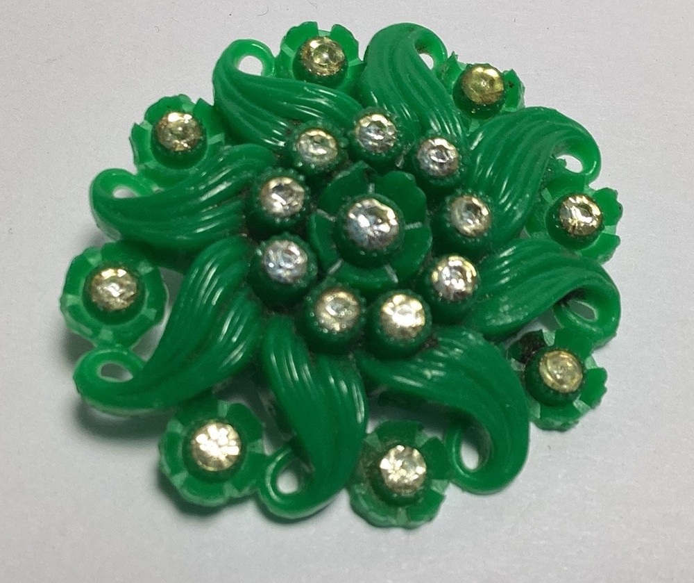 EARLY GREEN CELLULOID PLASTIC RHINESTONE BROOCH C-CLASP WISPY PINWHEEL FLOWER