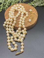 VTG 14kt gold, hand knotted, lustrous ivory 36″ South Seas pearl necklace, E/R’s