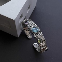 Openwork carved blue topaz bracelet for women, vintage style.
