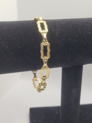Vintage gold-tone clamper bracelet with an openwork square link design 8.5in