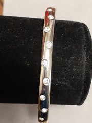 Crystal polka dot bangle bracelet Silvertone flush set stones eternity band