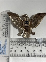 Vintage eagle brooch 1.5 Inches X 2 Inches Gold Colored With Red White And Blue