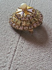 Brooch/pendant in lavender & yellow prong set rhinestones. Dome shape. Vintage