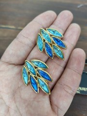 Yves Saint Laurent gold plated earrings, set with light blue and blue crystals