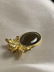 Vintage 1990s Gold Tone Angel Pendant with Deep Green Cabochon – 1.25 x 0.9 Inch