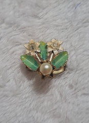 Vintage white flower and green leaf with pearl pendant, gold accents