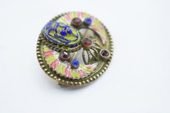 Antique Egyptian Revival winged scarab brooch featuring vibrant enamel work
