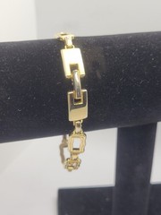 Vintage gold-tone clamper bracelet with an openwork square link design 8.5in