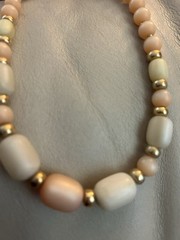 1980s Napier Pale Orange and Cream Lucite with Gold spacers Necklace.