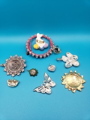 Mixed Costume Jewelry Lot: Pendants, Brooches, Rhinestone Bracelet & More
