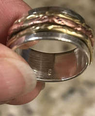 Tri-color sterling .925, brass, and copper spinner ring. Size 7. EUC