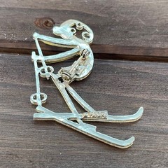Vintage Ski Pin Falling Skier Gold Tone Yellow Enamel Cartoon Style R.N. Koch